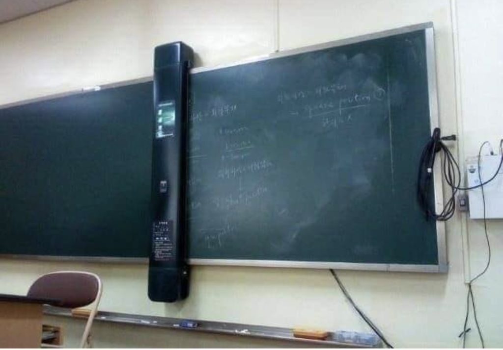 the school board is equipped with an electronic scanner that erases what is written and at the same time stores it so that the students can get later copies if they want