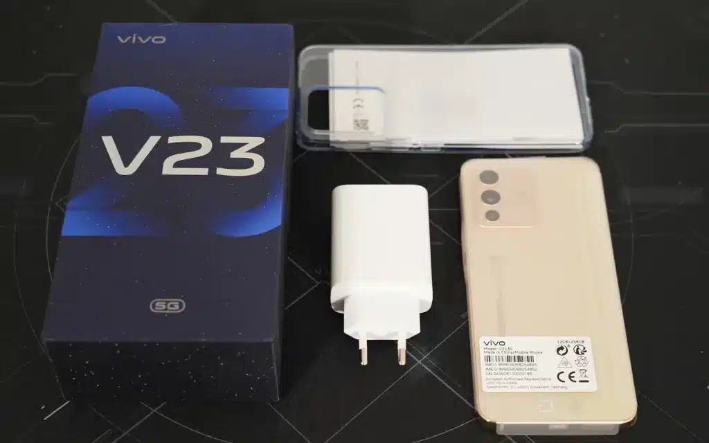 This is photo of Vivo V23 5G Smartphone with its box, charger, and phone cover