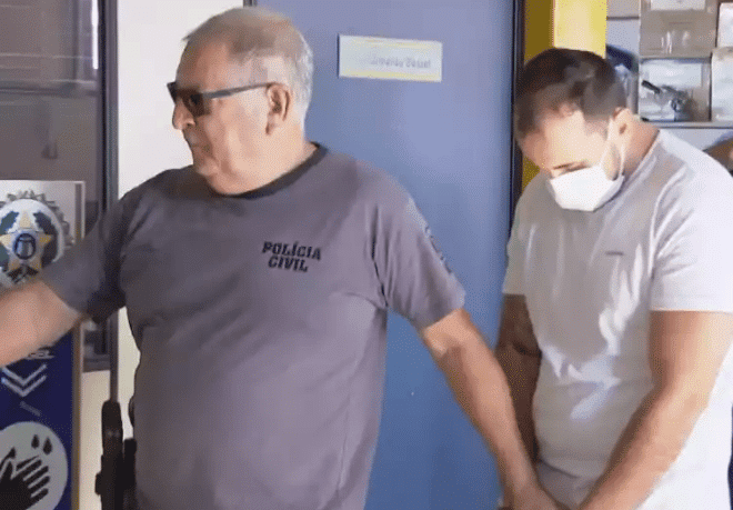 Dr Giovanni Quintella Bezerra under arrest by police 