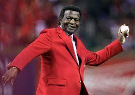 Lou Brock posing with ball in his hand. Lou brock cause of death explained.