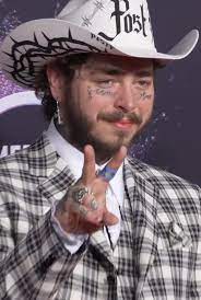 Post Malone wearing cow boy hat and he is getting viral because of the Post Maone fall video
